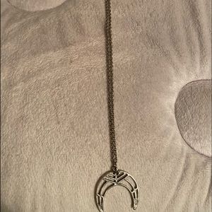 A half moon type styled necklace